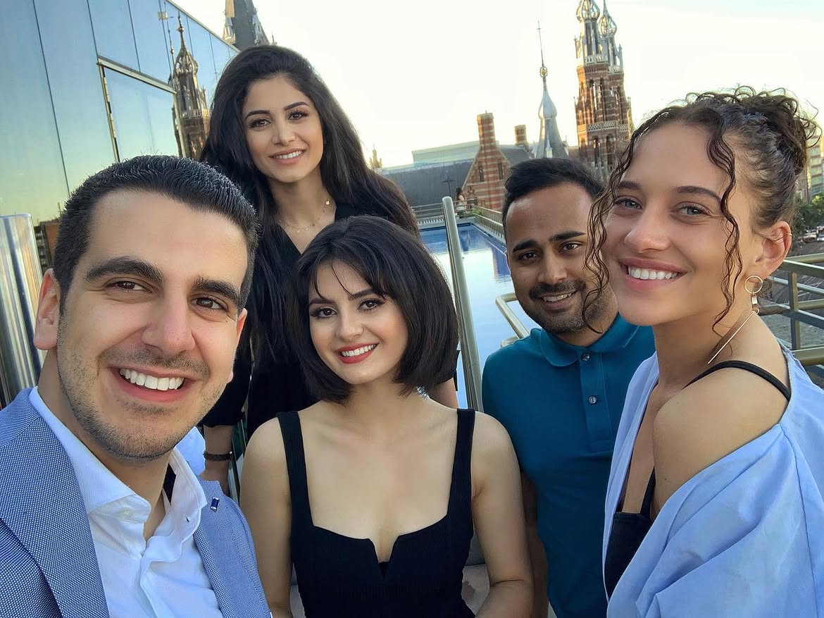 Friends together at a rooftop social gathering in Amsterdam